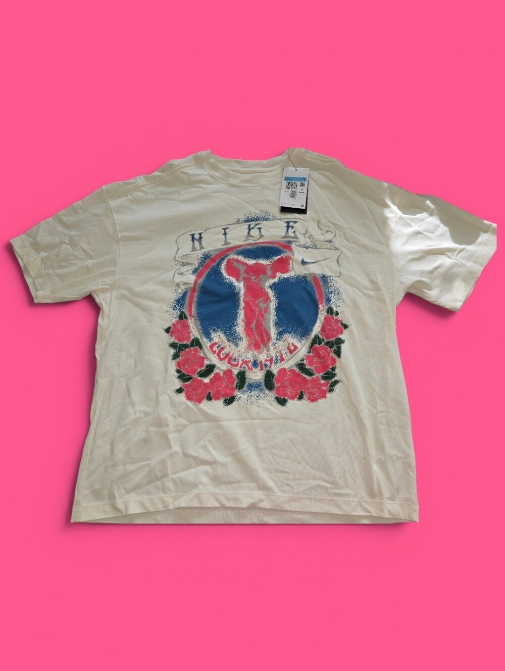 Ladies Nike Special Edition Cream Graphic Tee with Blue & Pink Floral Design